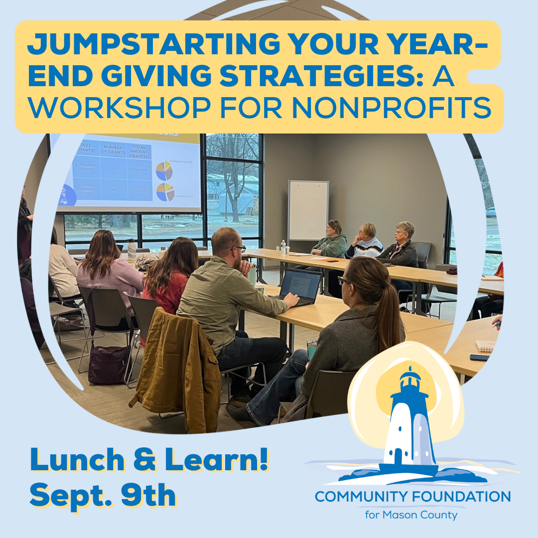 People attend a workshop in a conference room with a screen displaying a presentation. Text reads: Jumpstarting Your Year-End Giving Strategies: A Workshop for Nonprofits. Lunch & Learn! Sept. 9th. Community Foundation for Mason County.